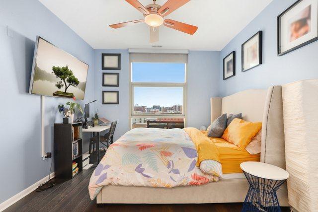 bedroom featuring dark wood-type flooring and ceiling fan