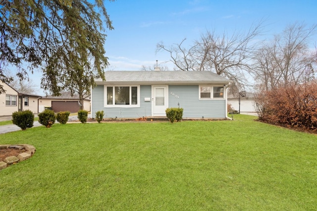 ranch-style house with a front yard and a garage