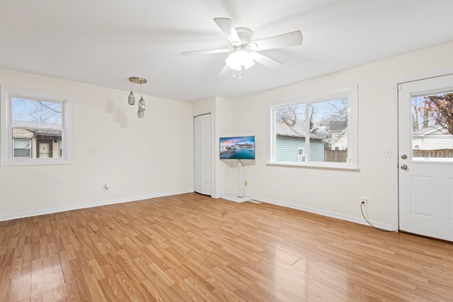 entrance foyer featuring ceiling fan and light wood-type flooring