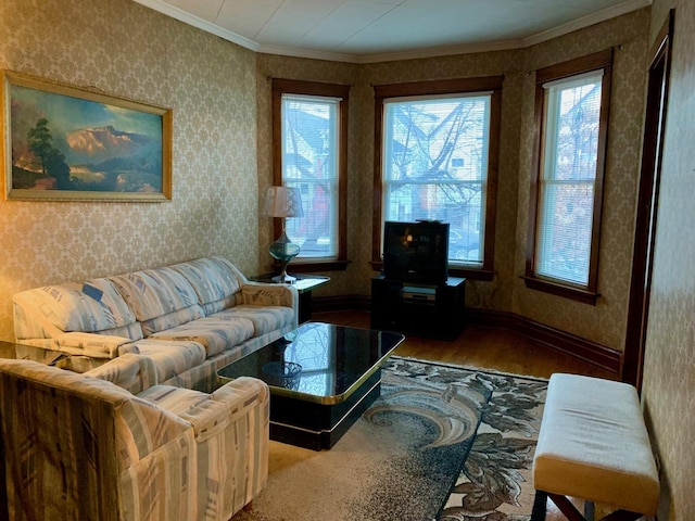 living room with hardwood / wood-style floors and crown molding