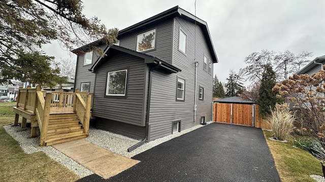 view of side of property with a deck