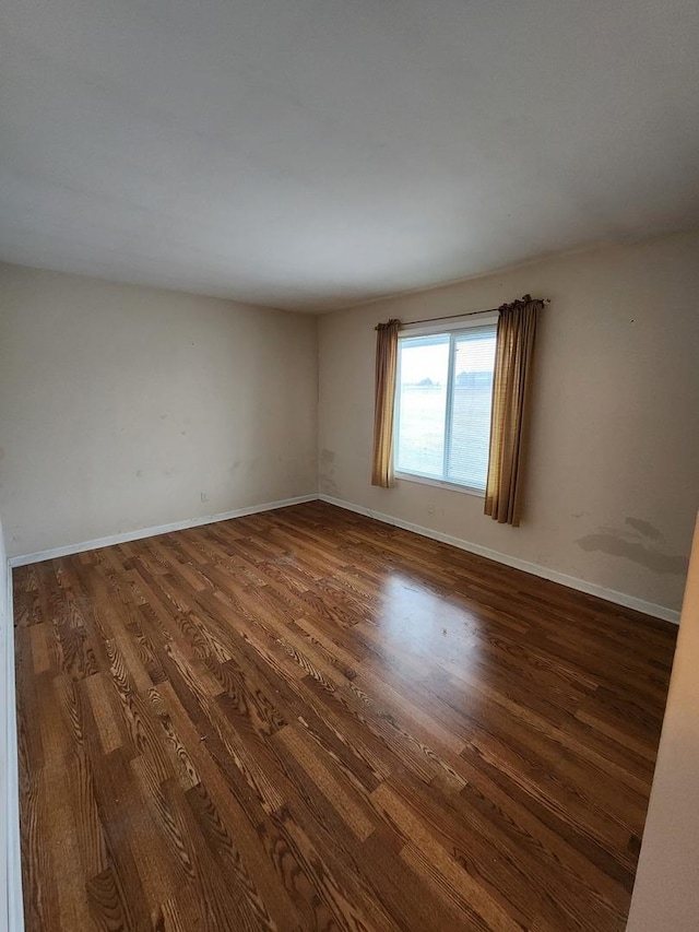 empty room featuring dark hardwood / wood-style floors