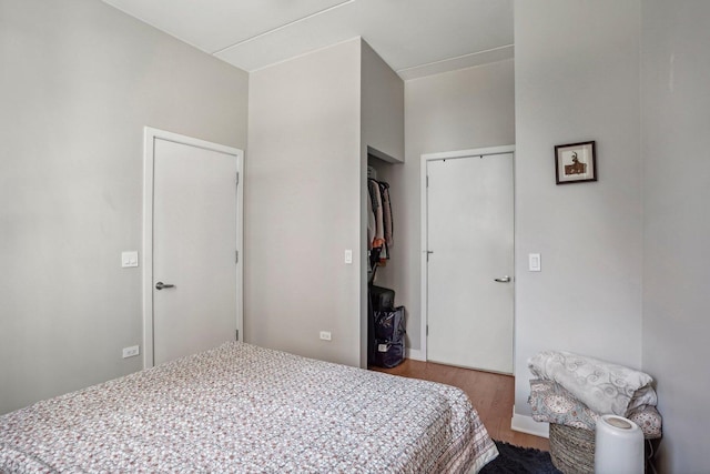 bedroom with a closet and light hardwood / wood-style flooring