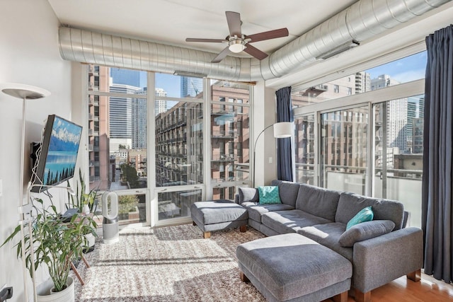 sunroom with ceiling fan