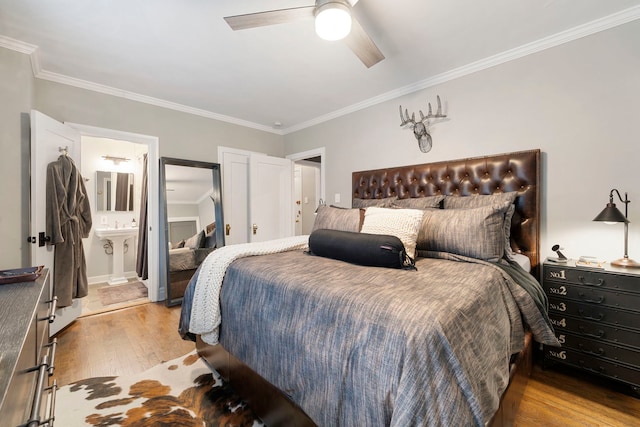 bedroom with ensuite bathroom, crown molding, ceiling fan, and light hardwood / wood-style floors