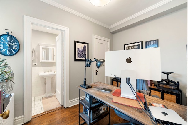 office featuring crown molding, dark hardwood / wood-style flooring, tile walls, and sink