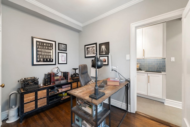 office area with dark wood-type flooring and ornamental molding