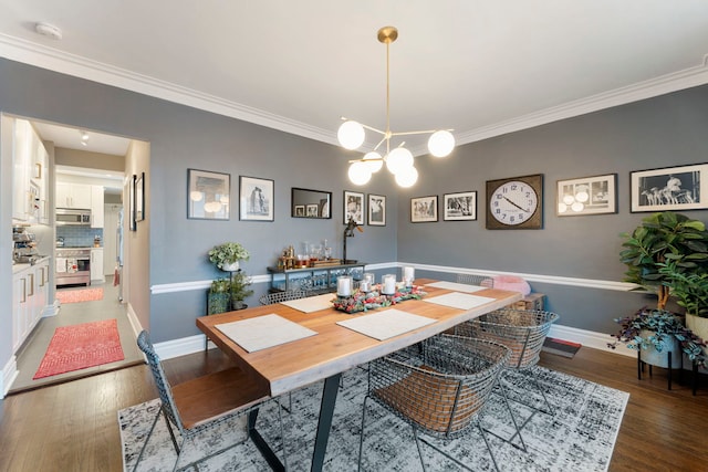 dining space featuring a chandelier, crown molding, and wood-type flooring