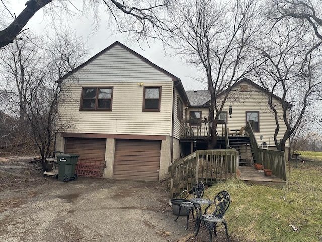 view of front of property with a garage and a wooden deck