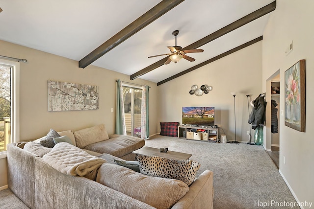 carpeted living room with beamed ceiling, high vaulted ceiling, and ceiling fan