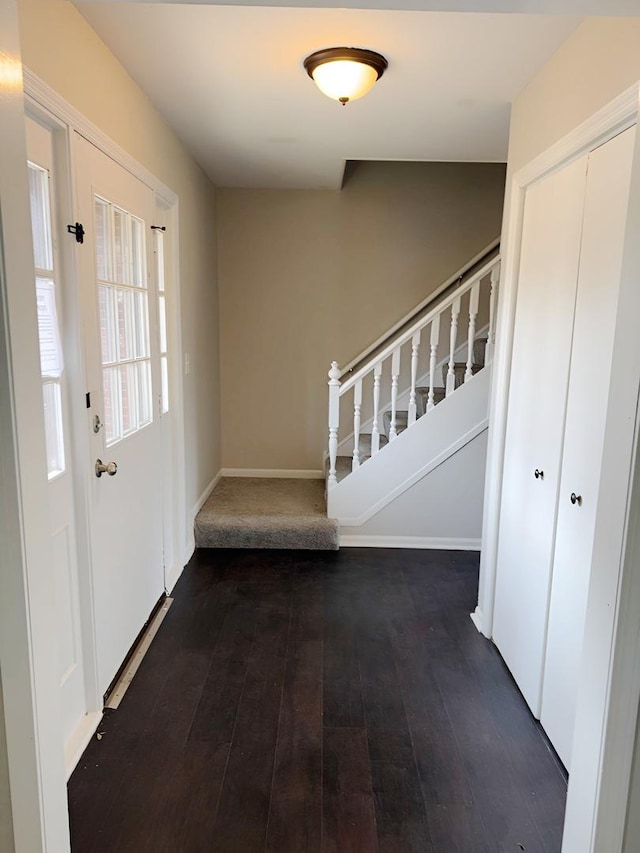 6111 Pingree Rd, Crystal Lake, IL 60014 - foyer entrance with stairway, dark wood-style floors, and baseboards