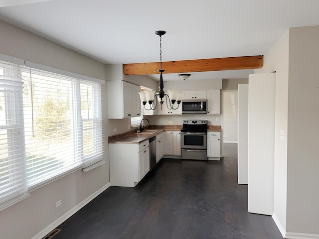 6111 Pingree Rd, Crystal Lake, IL 60014 - kitchen featuring stainless steel appliances, baseboards, beamed ceiling, a chandelier, and white cabinets