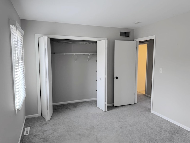 6111 Pingree Rd, Crystal Lake, IL 60014 - unfurnished bedroom with carpet floors, multiple windows, a closet, and baseboards