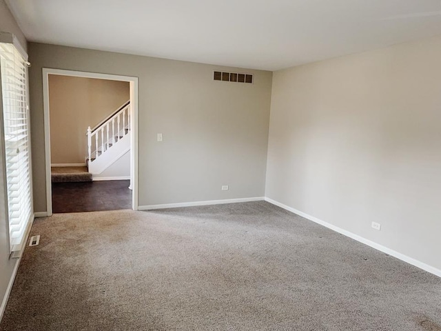 6111 Pingree Rd, Crystal Lake, IL 60014 - carpeted empty room with stairway and baseboards