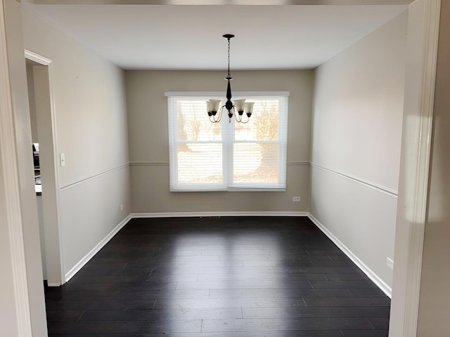6111 Pingree Rd, Crystal Lake, IL 60014 - unfurnished dining area featuring a chandelier, dark wood finished floors, and baseboards