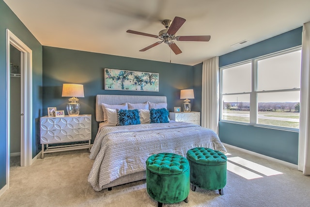 carpeted bedroom with ceiling fan