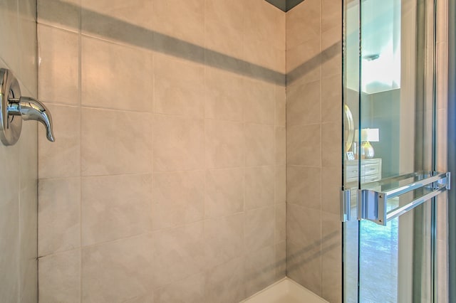 bathroom with a tile shower