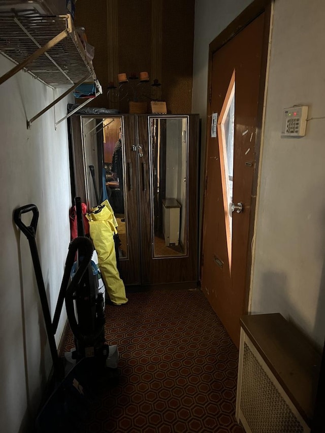 corridor with dark carpet