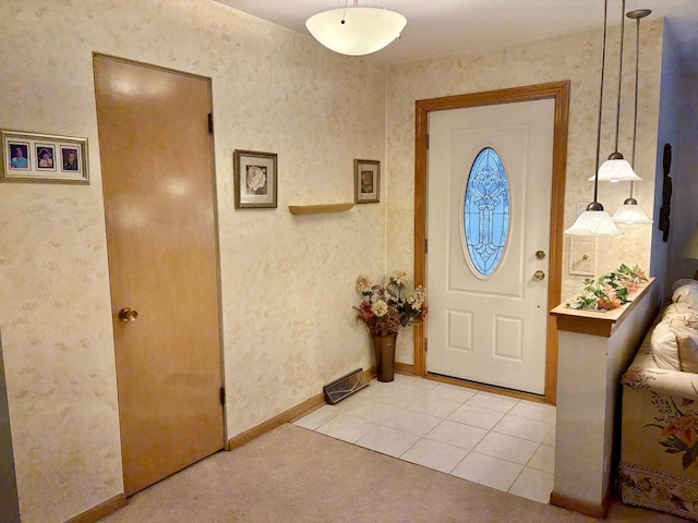 foyer entrance featuring light tile patterned flooring