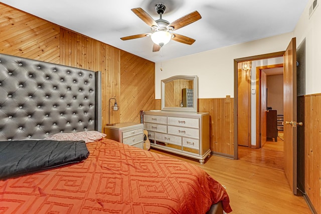 16734 Evans Ave, South Holland, IL 60473 - bedroom featuring wooden walls, wood finished floors, wainscoting, and a ceiling fan