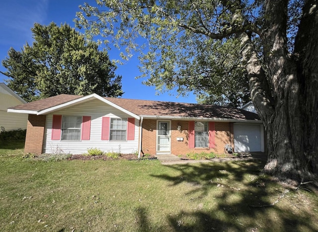 ranch-style home with a front yard and a garage