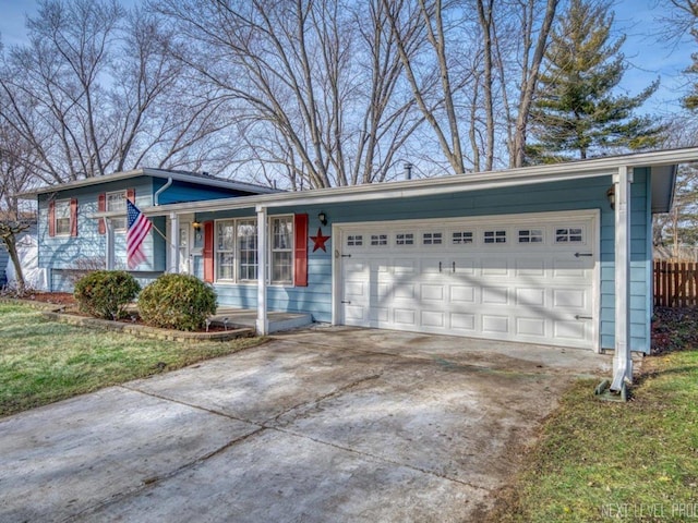 view of front of house with a front yard and a garage