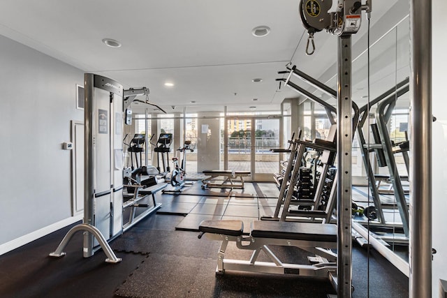 workout area featuring floor to ceiling windows