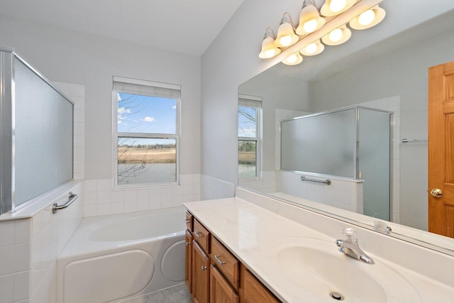 bathroom featuring tile patterned flooring, vanity, and independent shower and bath