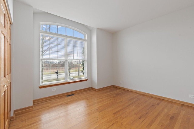 unfurnished room featuring light hardwood / wood-style flooring