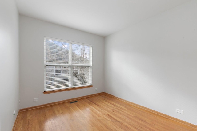 empty room with light wood-type flooring