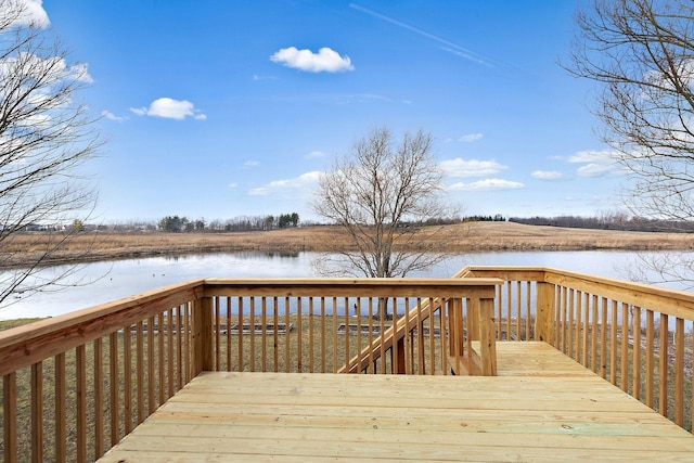 wooden deck featuring a water view