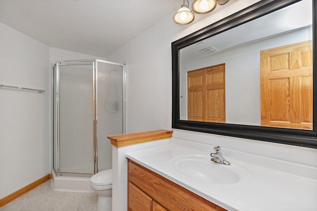 bathroom featuring vanity, toilet, and a shower with door