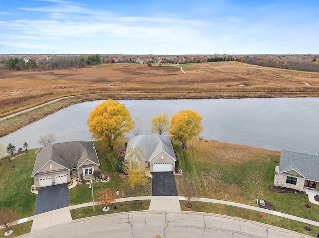 birds eye view of property featuring a rural view and a water view