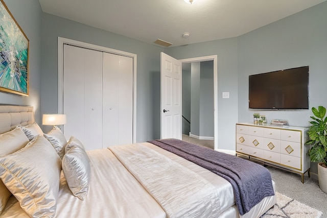 carpeted bedroom featuring a closet