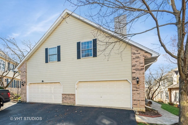 view of side of home with a garage