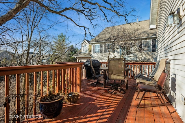 wooden terrace with area for grilling