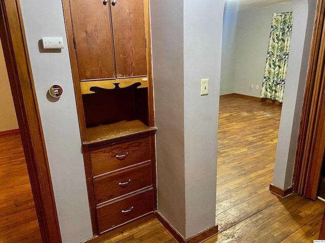 hallway featuring dark hardwood / wood-style flooring