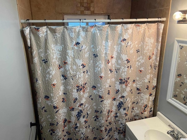 bathroom with vanity and curtained shower