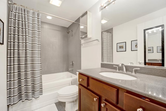 full bathroom with tile patterned flooring, shower / tub combo with curtain, vanity, and toilet