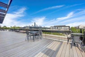 wooden deck featuring a water view