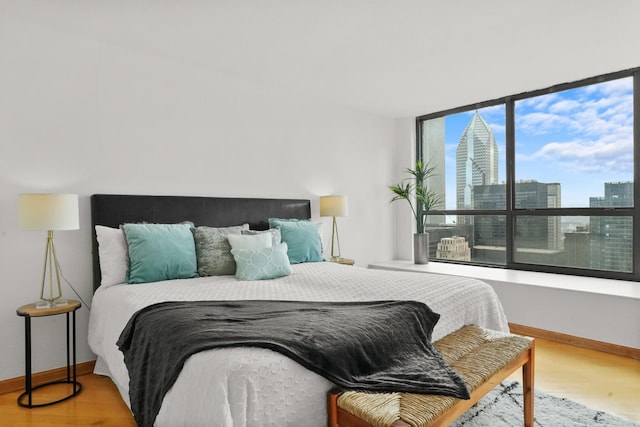 bedroom with wood-type flooring