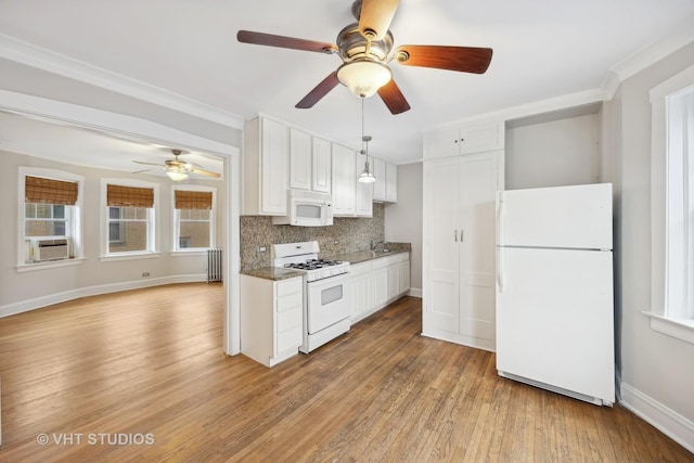 kitchen with white appliances, white cabinetry, backsplash, dark stone countertops, and light hardwood / wood-style floors