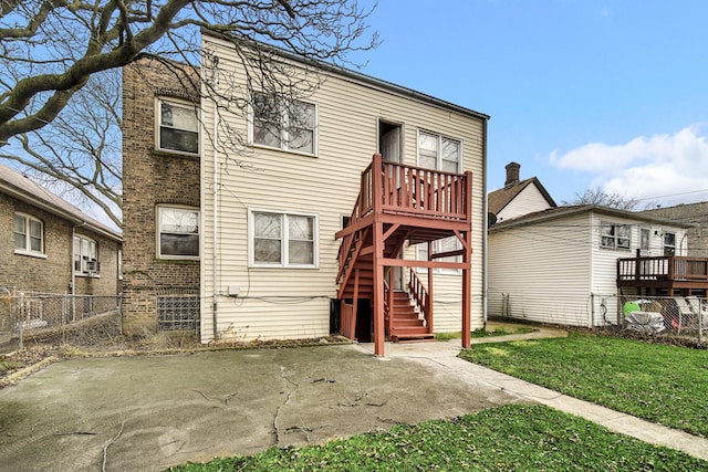 rear view of house with a patio area and a yard