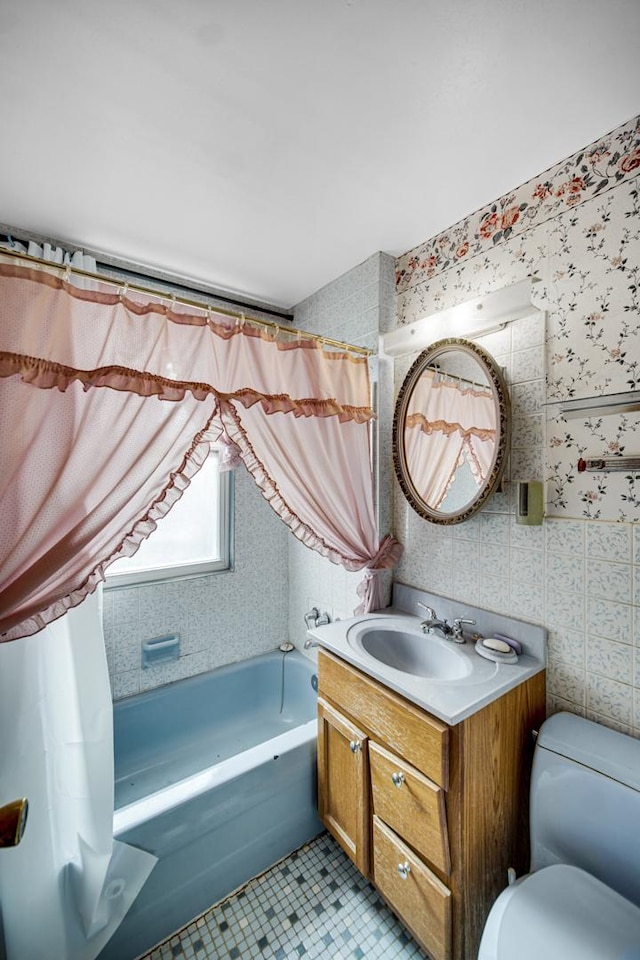 bathroom with tile patterned flooring, vanity, and toilet