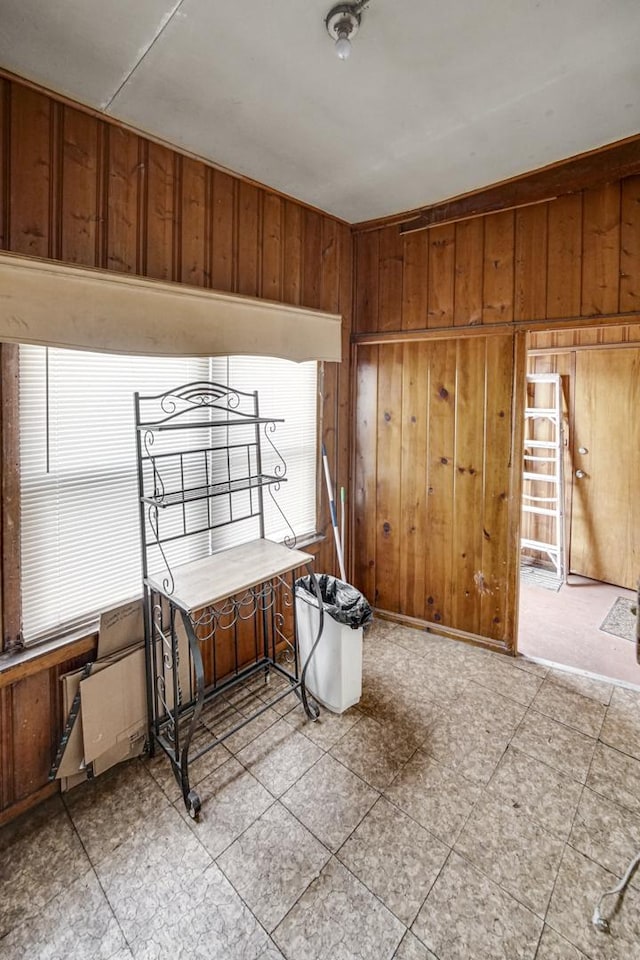 miscellaneous room featuring wooden walls