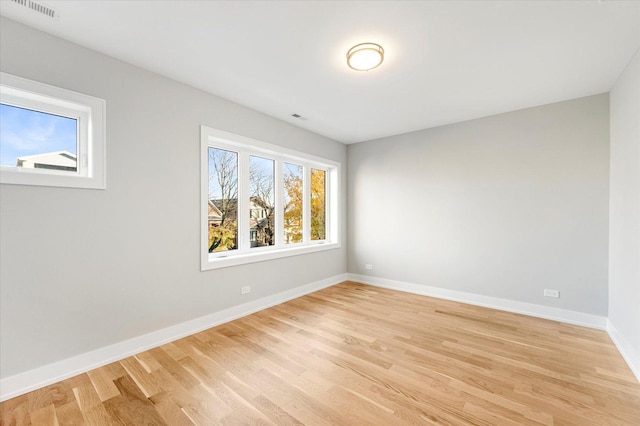 unfurnished room featuring light hardwood / wood-style flooring