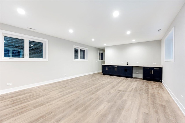 unfurnished living room featuring light hardwood / wood-style flooring