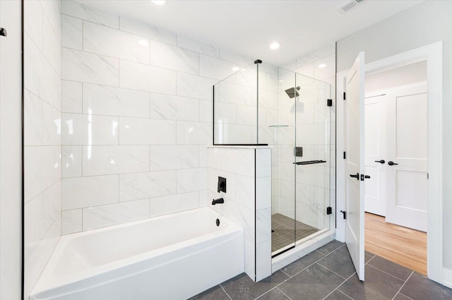 bathroom with plus walk in shower and tile patterned floors