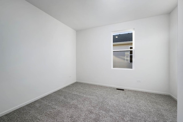 empty room with carpet flooring