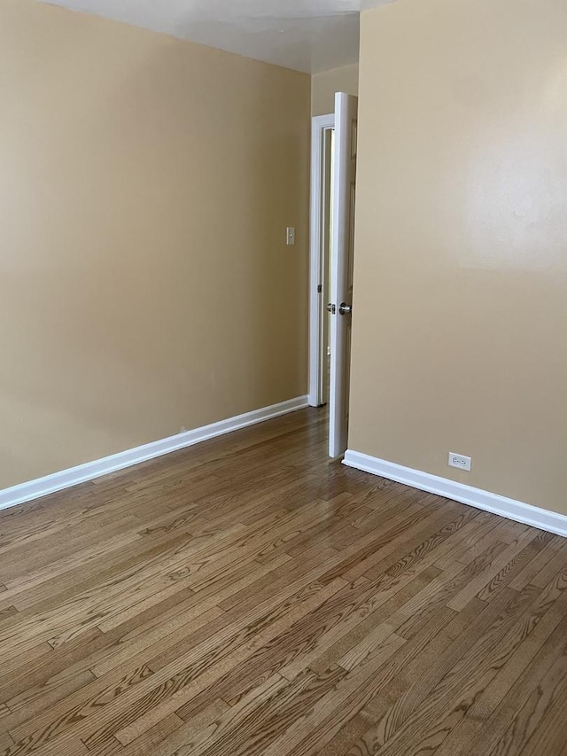 spare room featuring hardwood / wood-style flooring